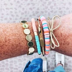 Personalized Bracelet -Fashion Clothing Store 04n gold personalized bracelete on arm stacked with variety bracelets