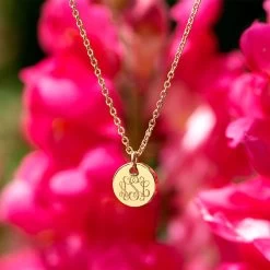 Monogrammed Tiny Disc Necklace -Fashion Clothing Store 0r3 tiny disc necklace around neck gold in front red flowers