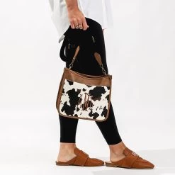 Monogrammed Saddlebag -Fashion Clothing Store 3ub cowhide saddlebag in hand