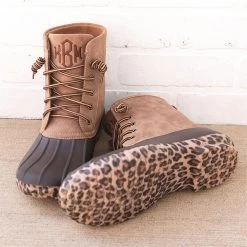 Monogrammed Leopard Sole Duck Boots -Fashion Clothing Store 4DB leopard bottom duck boots in front of white brick wall