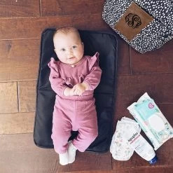 Monogrammed Dottie Diaper Backpack 9 Monogrammed Dottie Diaper Backpack -Fashion Clothing Store 7IE baby laying on dottie diaper backpack changing pad