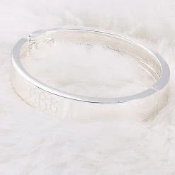Monogrammed Cuff Bracelet 9 Monogrammed Cuff Bracelet -Fashion Clothing Store 9DF silver cuff bracelet on faux fur