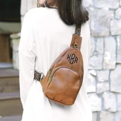 Monogrammed Sling Purse -Fashion Clothing Store B8a brown sling purse worn on back