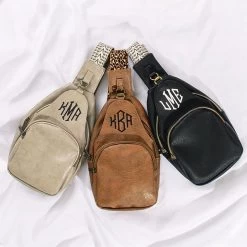 Monogrammed Sling Purse -Fashion Clothing Store B8a taupe brown and black sling purses on white sheet