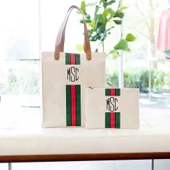 Monogrammed Canvas Pouch -Fashion Clothing Store BAx canvas bag and pouch on lobby bench