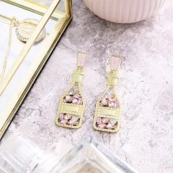 Rosé All Day Earrings 6 Rosé All Day Earrings -Fashion Clothing Store BHk rose all day earrings on marble counter