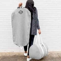 Monogrammed Quilted Weekender -Fashion Clothing Store DAt gray monogrammed quilted weekend bag and garment bag with girl