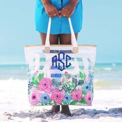 Monogrammed Large Beach Bag -Fashion Clothing Store DeT large monogrammed floral beach bag in hands