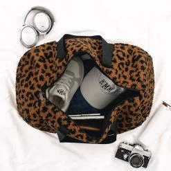 Sherpa Duffel Bag -Fashion Clothing Store FC9 inside of sherpa duffel bag in leopard