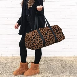 Sherpa Duffel Bag -Fashion Clothing Store FC9 sherpa fuzzy duffel bag in hickory leopard on wrist