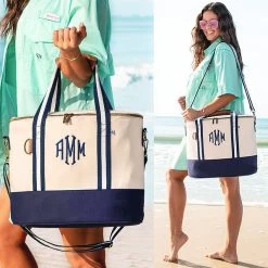 Personalized Canvas Cooler -Fashion Clothing Store GWh monogrammed canvas cooler in navy at beach on shoulder and wrist