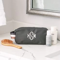 Monogrammed Classic Cosmetic Case -Fashion Clothing Store H8M charcoal classic cosmetic case on counter