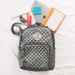 Monogrammed Quilted Laptop Backpack -Fashion Clothing Store Hgd Monogrammed Quilted Laptop Backpack with headphones and accessories