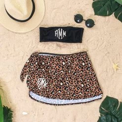 Monogrammed Sarong 11 Monogrammed Sarong -Fashion Clothing Store HiI black bandeau top with monogrammed cheetah sarong on sand