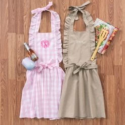 Fashion Clothing Store -Fashion Clothing Store Jmf name on apron pink gingham brown flatlay