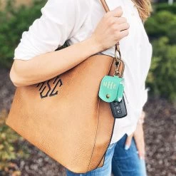 Monogrammed AirPod Case Keychain -Fashion Clothing Store KgV mint earbud keychain linked on bag