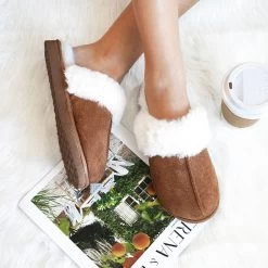 Sherpa Slippers -Fashion Clothing Store LJc brown sherpa slippers on white fur rug with magazine