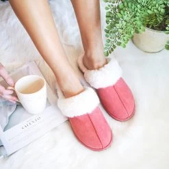 Sherpa Slippers -Fashion Clothing Store LJc pink sherpa slippers on feet lounging on bed with coffee mug