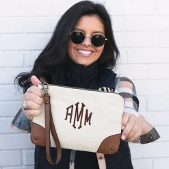 Monogrammed Vintage Clutch -Fashion Clothing Store Lst vintag clutch held in front of brunette girl