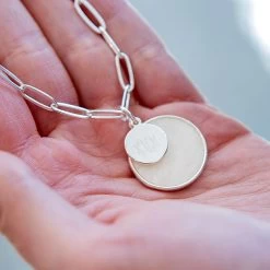 Monogrammed Layered Disc Necklace 8 Monogrammed Layered Disc Necklace -Fashion Clothing Store Lxq silver monogrammed layered shell necklace in hands