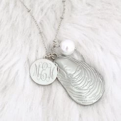 Monogrammed Oyster Charm Necklace -Fashion Clothing Store OPJ detail shot of silver oyster necklace