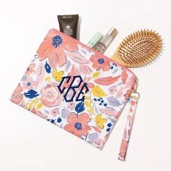 Monogrammed Wristlet Pouch -Fashion Clothing Store OnF spill shot of navy bouquet wristlet pouch