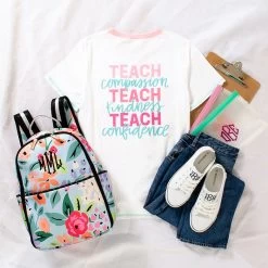 Monogrammed Teacher T-Shirt -Fashion Clothing Store Ot7 flatlay of teacher t shirt with clipboard and backpack