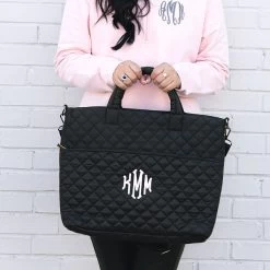 Monogrammed Quilted Laptop Bag -Fashion Clothing Store PGX black quilted laptop bag in hands