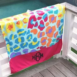 Personalized Beach Towel -Fashion Clothing Store PIv leopard luau personalized beach towel on railing