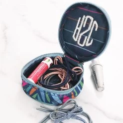 Monogrammed Travel Jewelry Case -Fashion Clothing Store RIE navy safari travel case with chapstick and hair ties