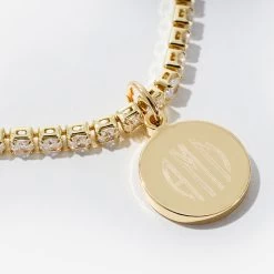 Personalized Tennis Bracelet -Fashion Clothing Store RVR monogrammed tennis bracelet in gold close up