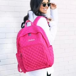 Monogrammed Quilted Laptop Backpack -Fashion Clothing Store SRe hot pink quilted laptop backpack on shoulder name