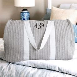 Monogrammed Quilted Weekender -Fashion Clothing Store SmT monogrammed quilted weekend bag on bed