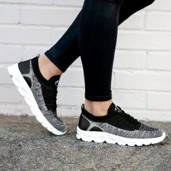 Monogrammed Scallop Sneakers -Fashion Clothing Store TSw black scallop sneakers walking image on feet