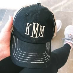 Monogrammed Trucker Hat -Fashion Clothing Store TZn black trucker hat in hand selfie