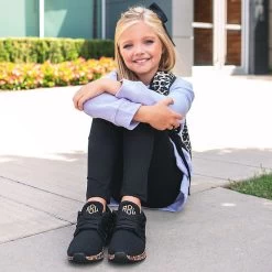 Monogrammed Youth Leopard Bottom Sneakers -Fashion Clothing Store U6B girl in black leggings and black leopard shoes