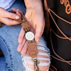 Monogrammed Corded Lanyard -Fashion Clothing Store UNi close up holding duck boot lanyard