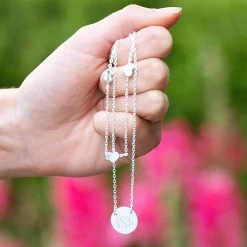 Monogrammed Heart Multi Strand Necklace 7 Monogrammed Heart Multi Strand Necklace -Fashion Clothing Store V7M siler layered multistrand heart necklace held by flowers