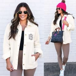 Monogrammed Sherpa Shacket -Fashion Clothing Store VLF ivory sherpa shacket split styled with pink beanie crossbody leggings