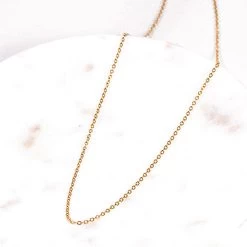 DIY Letter Necklace -Fashion Clothing Store VPm diy charm necklace on marble