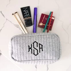 Monogrammed Quilted Cosmetic Case -Fashion Clothing Store VdS gray quilted cosmetic case spill shot