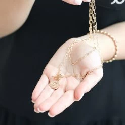 Initial Layered Necklace -Fashion Clothing Store VyX C initial layered necklace in hands