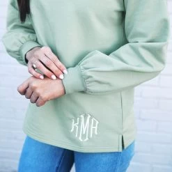 Monogrammed Puff Sleeve Sweatshirt -Fashion Clothing Store aMd aloe closeup of sleeve on puff sleeve sweatshirt denim white wall