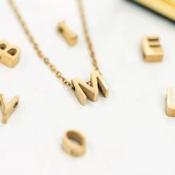 DIY Letter Necklace -Fashion Clothing Store hPv m charm on necklace and loose charms