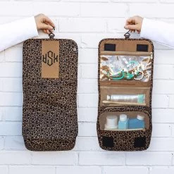 Monogrammed Packable Hanging Travel Case 17 Monogrammed Packable Hanging Travel Case -Fashion Clothing Store ihT front and inside of hanging travel cosmetic case in brown leopard