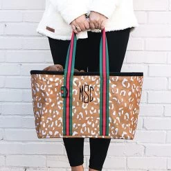Monogrammed Market Basket -Fashion Clothing Store jiU caramel leopard market basket in hand front view white wall