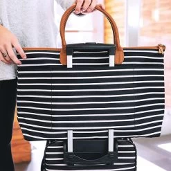 Monogrammed Carry-On Bag -Fashion Clothing Store jsR monogrammed black and white striped carry on on top of suitcase detail