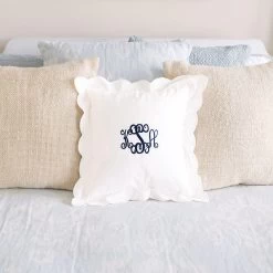 Fashion Clothing Store -Fashion Clothing Store l8G monogrammed white scalloped pillow sham on bed