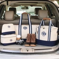 Monogrammed Canvas Train Case 10 Monogrammed Canvas Train Case -Fashion Clothing Store m3Y monogrammed navy canvas travel bags packed in trunk with duck boots