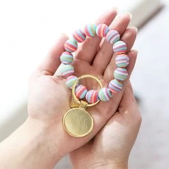 Monogrammed Bracelet Key Ring -Fashion Clothing Store mu5 girl holding rainbow stripes beaded bracelet key ring